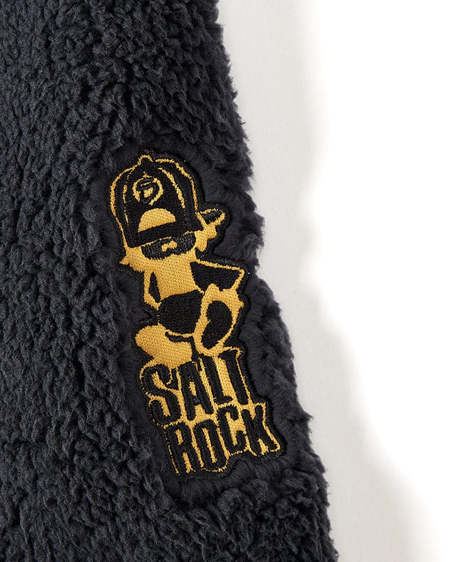 A Tagged - Kids Sherpa Fleece - Black jacket with the Saltrock logo on it.