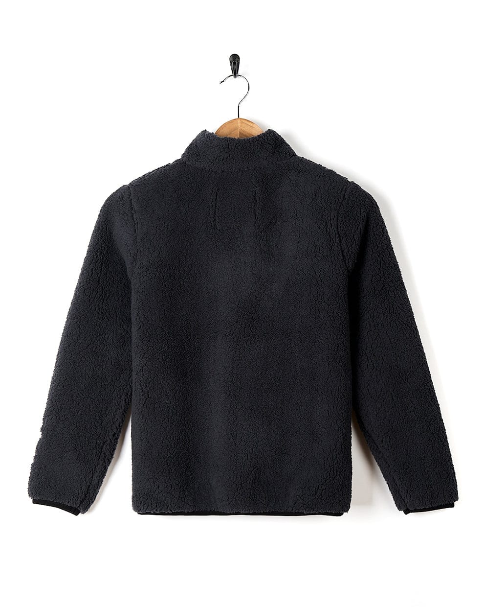 A Tagged - Kids Sherpa Fleece - Black jacket hanging on a hanger by Saltrock.