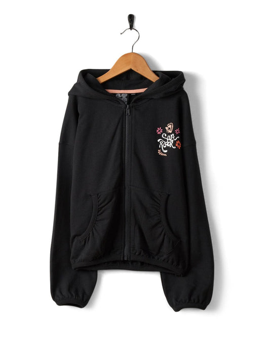 Tahiti Van - Kids Zip Hoodie - Washed Black with Saltrock branding on the chest, hanging on a wooden hanger against a white background.