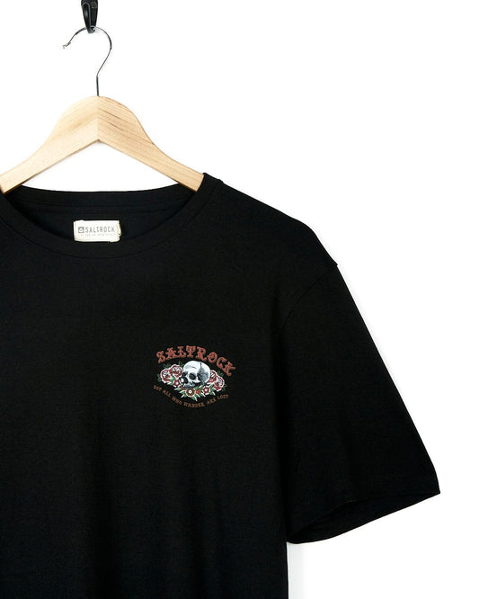 A Saltrock Tattoo Island 2 - Mens Short Sleeve T-Shirt - Black with a skull and crossbones embroidered on it.