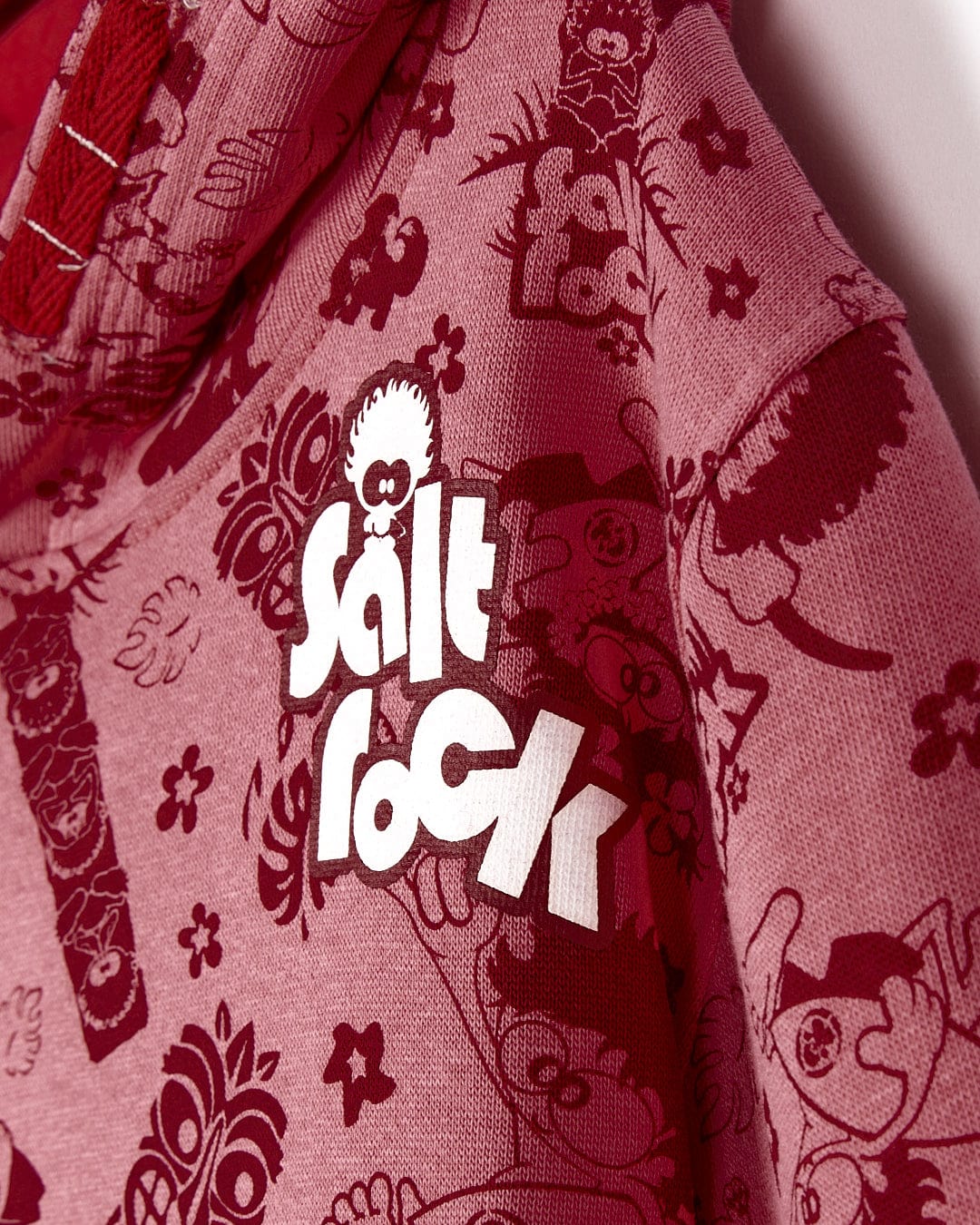 A Tiki Tok - Kids Pop Hoodie - Red with the word Saltrock on it.