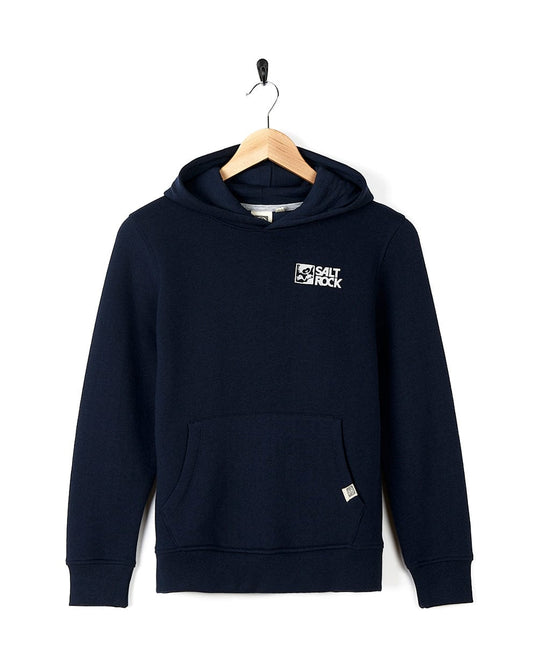 Dark Blue Tok Corp Kids Pop Hoodie hanging on a coat hanger against a white background, featuring Saltrock branding on the chest and a front pocket.