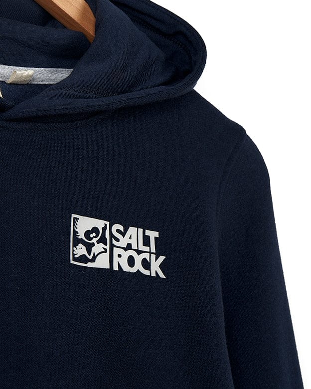 Close-up of a navy blue Tok Corp Recycled Kids Pop Hoodie in Dark Blue with the Saltrock branding on the left chest, displayed on a wooden hanger.