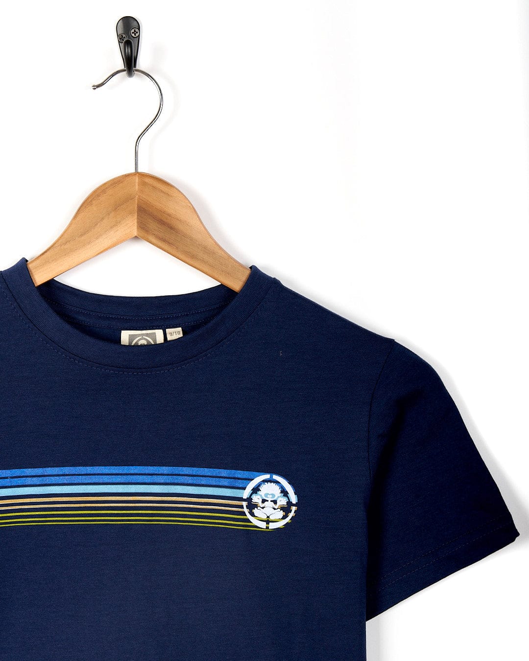 A navy Saltrock Tok Stripe - Kids Short Sleeve Tee - Dark Blue with retro stripes in blue, green, and yellow.