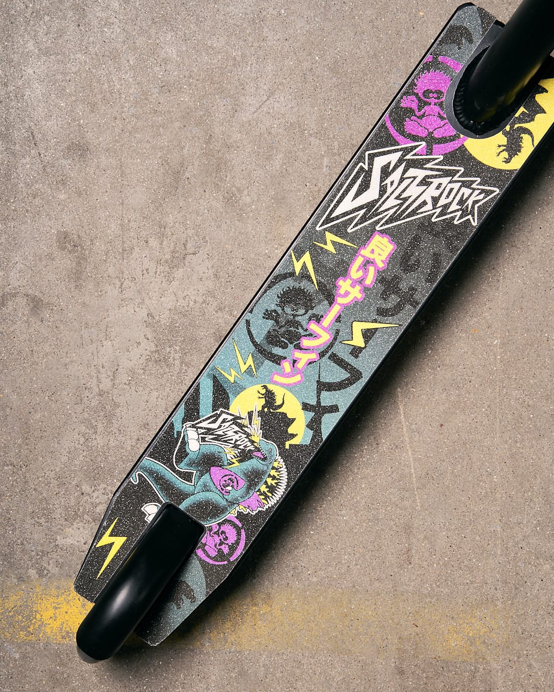 A Tokyo Smackdown - Stunt Scooter - Black with a colorful design on it. (Brand: Saltrock)