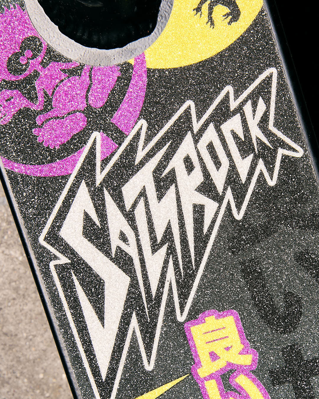 A Tokyo Smackdown - Stunt Scooter - Black with the brand name Saltrock on it.