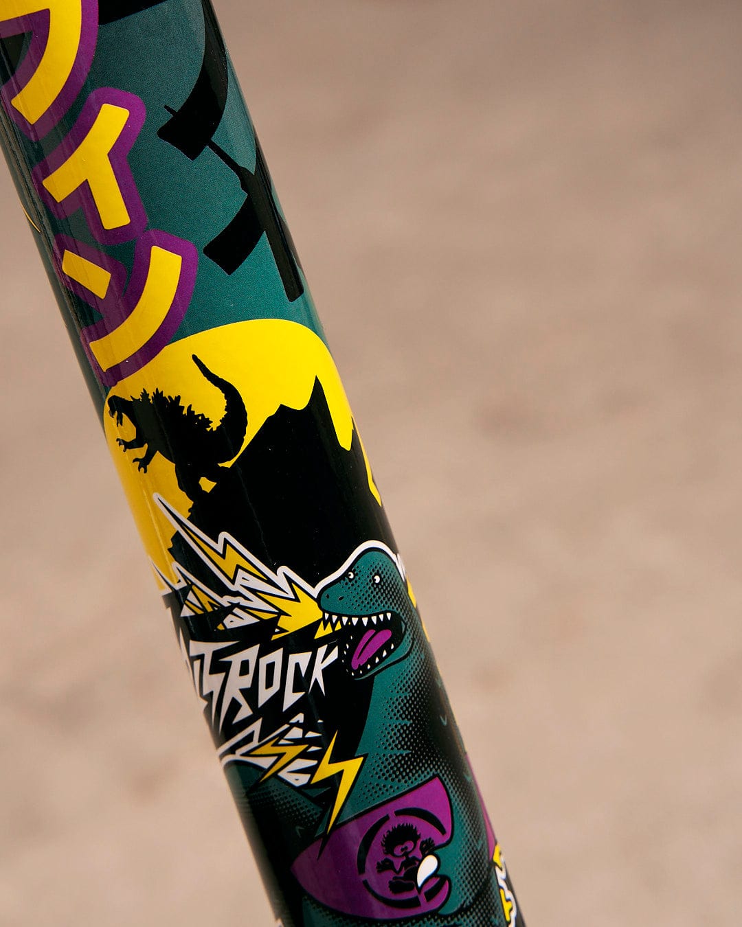 A close up of a Tokyo Smackdown - Stunt Scooter - Black with a dragon on it, made by Saltrock.