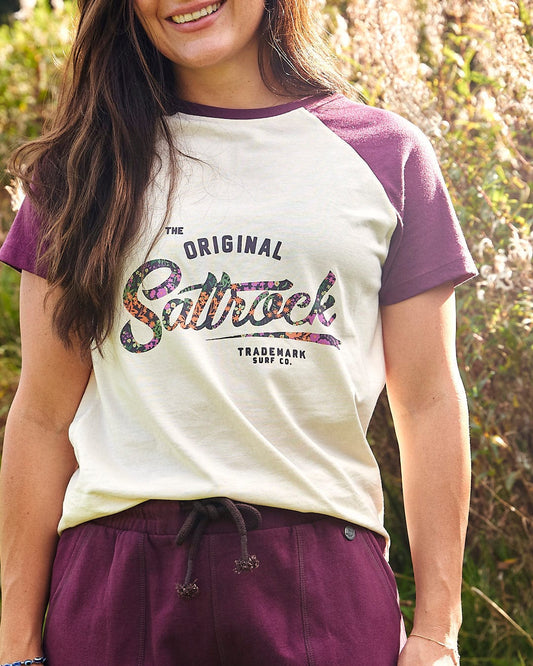 A woman wearing a Saltrock Trademark Floral - Womens Short Sleeve T-Shirt - Cream.