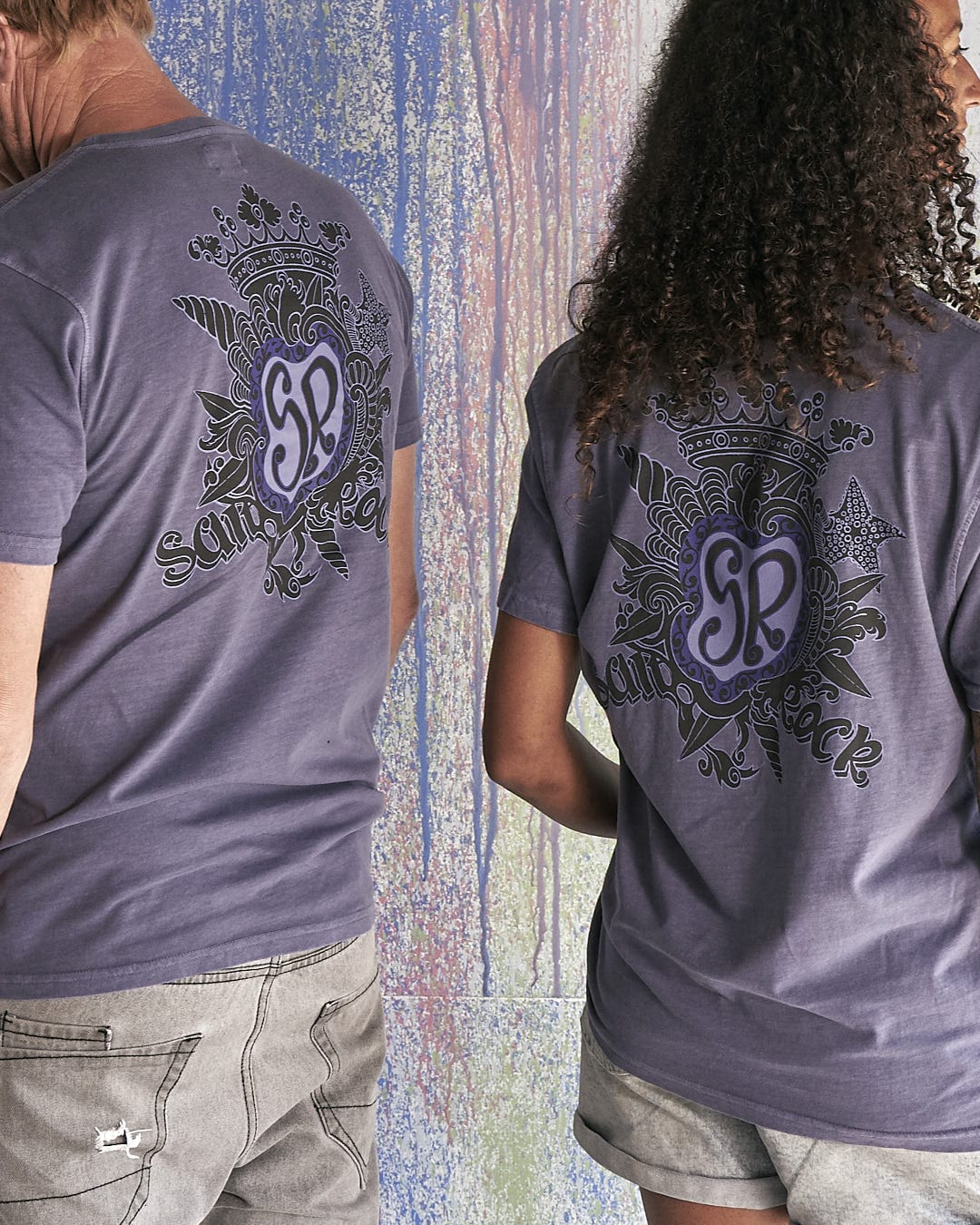 A man and woman wearing a Saltrock - Limited Edition 35 Years T-Shirt.