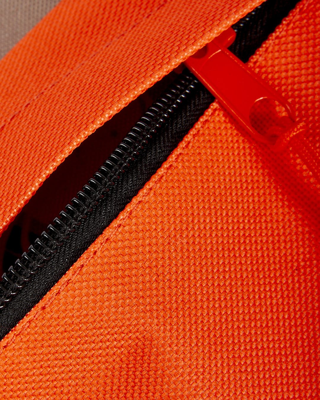 A close up of a Saltrock Uni-Camo - Backpack - Grey in bright orange.