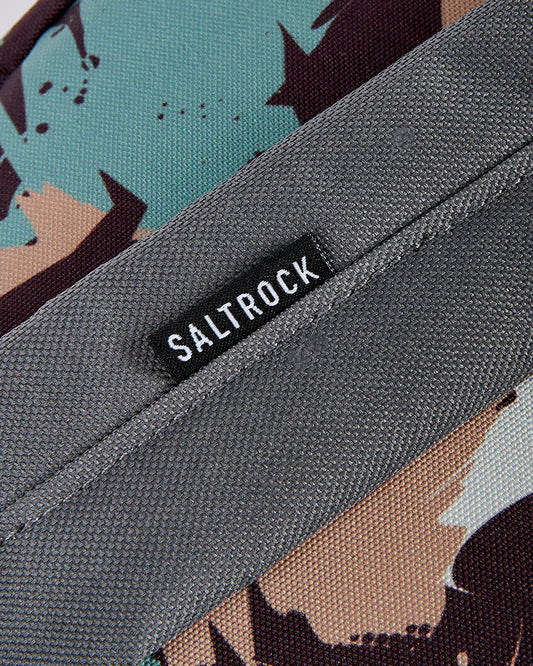 A close up of a Saltrock Uni-Camo backpack, perfect for beach days with its water resistant coating.