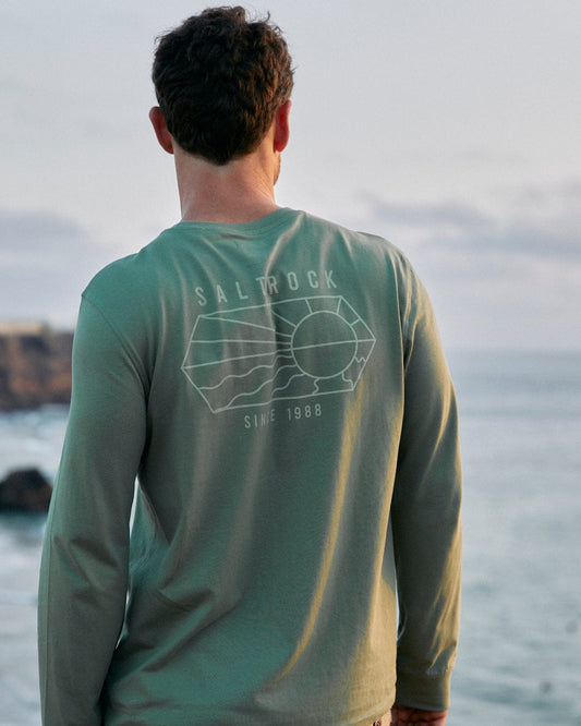 The back of a man wearing a Vantage Outline - Mens Long Sleeve T-Shirt in Green with Saltrock branding.