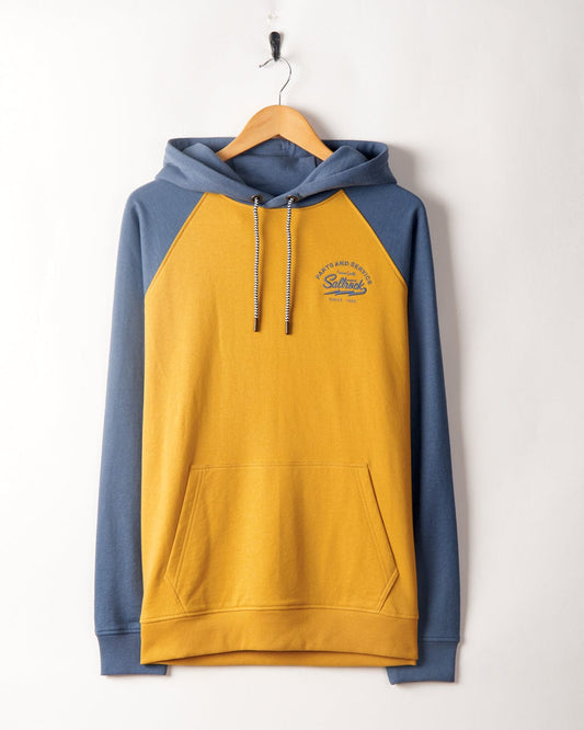 A Saltrock Vegas Script - Mens Pop Raglan Hoodie - Yellow hooded sweatshirt with raglan sleeves hanging on a wall hook, featuring a small logo on the left chest.
