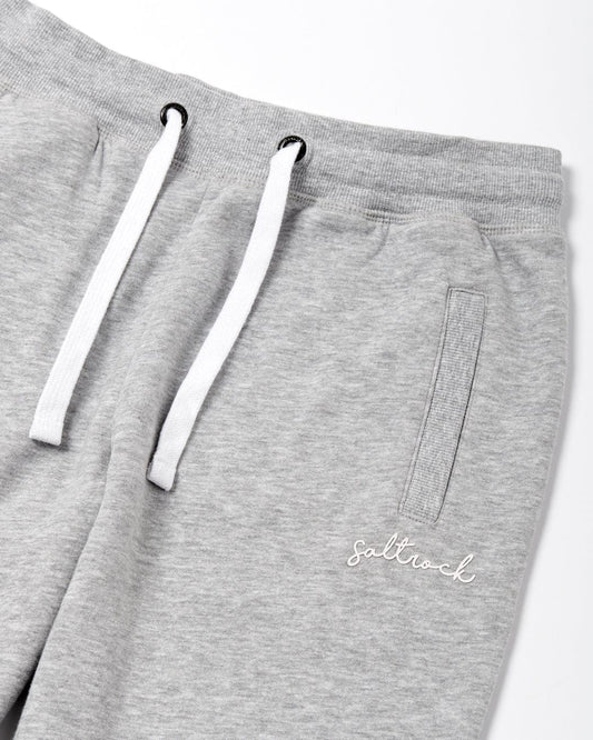 Close-up of Velator joggers in grey with white drawstrings and Saltrock branding on the left leg.
