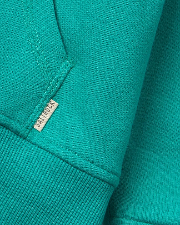A close up of a green Velator lined hoodie featuring Saltrock branding.
