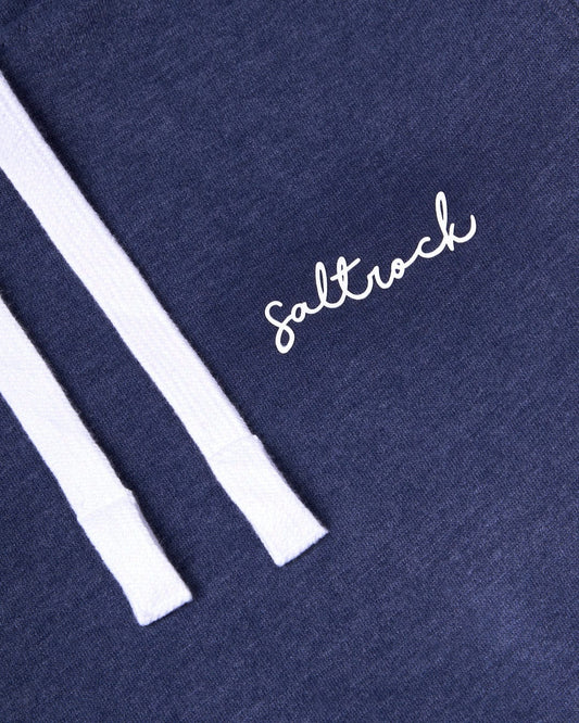 Close-up of a navy Velator - Womens Pop Hoodie - Dark Blue with the word "Saltrock" embroidered in white, next to a contrasting draw cord.
