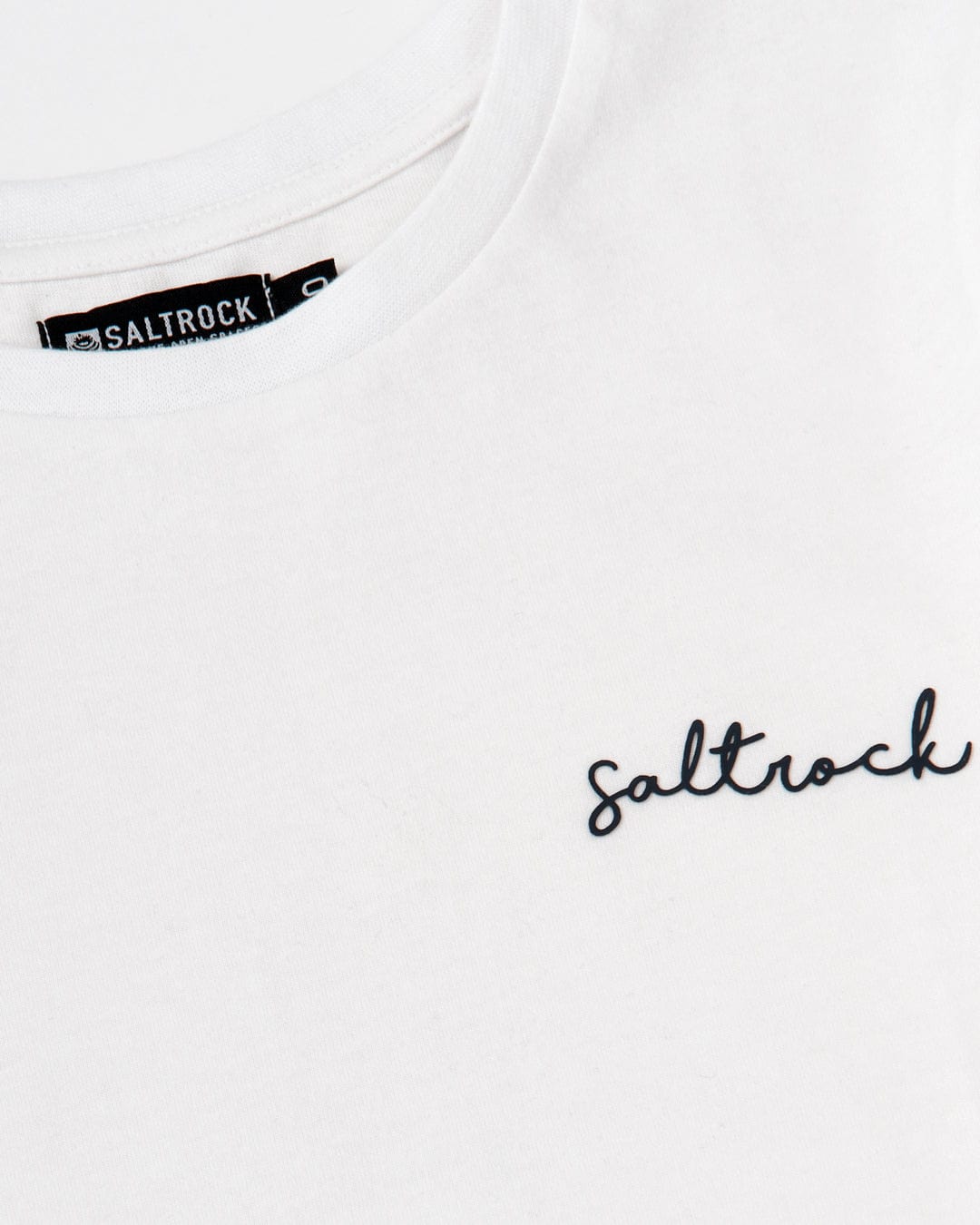 A Velator - Womens Short Sleeve T-Shirt - White with the word Saltrock embroidered on it, showcasing the Saltrock branding.