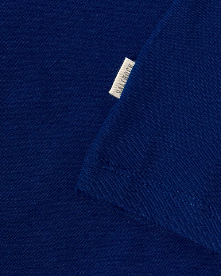 A close up of a blue Saltrock t-shirt from the Velator - Womens Short Sleeve T-Shirt - Navy range, an essential addition to any core wardrobe.