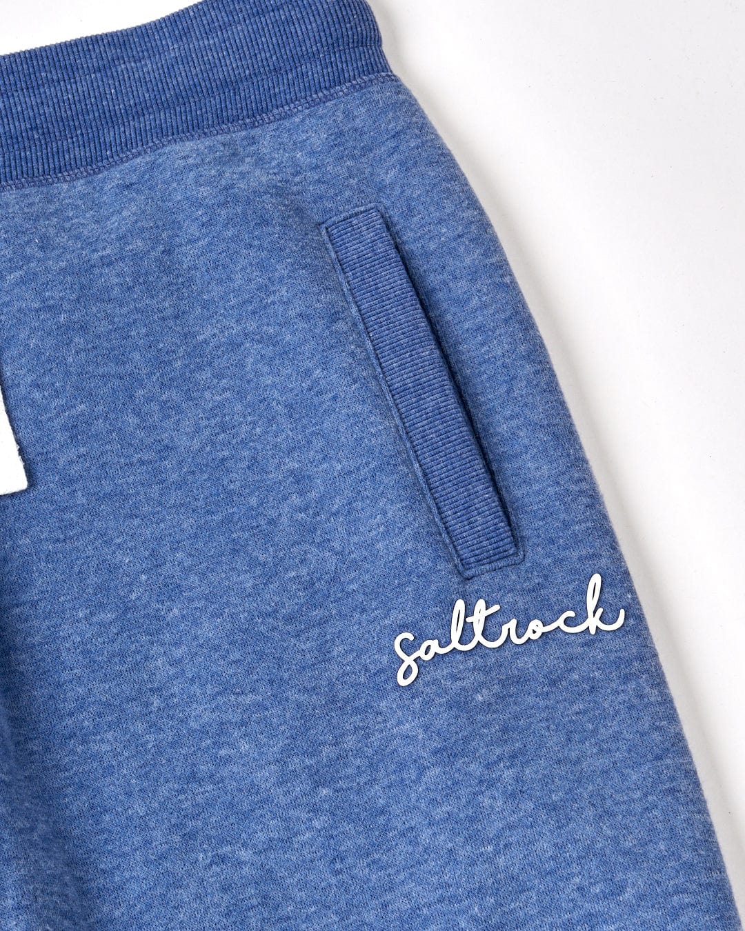 A blue sweatpants from Saltrock's Velator - Womens Jogger - Navy range with the word "Saltrock" on it.