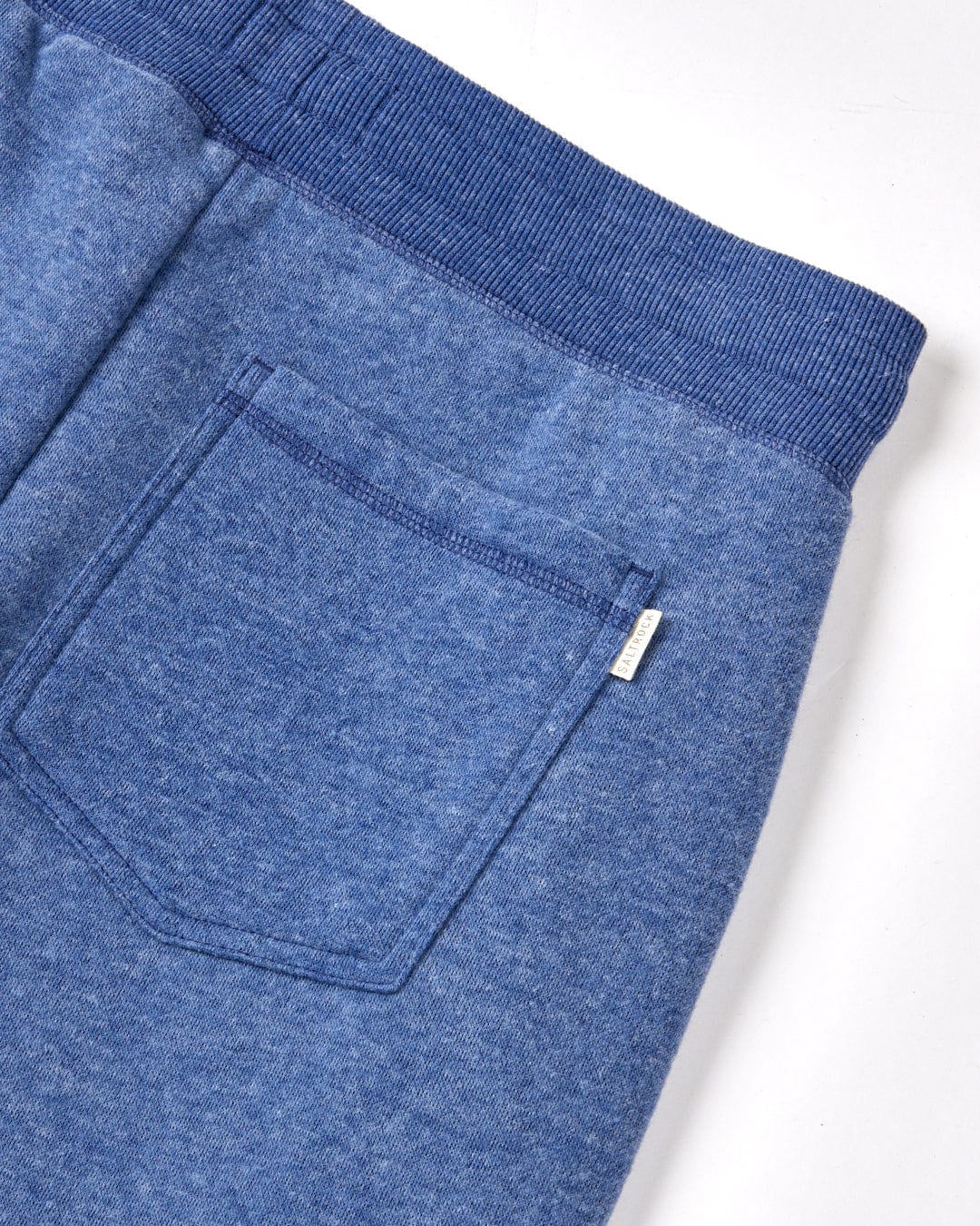 The back pocket of a blue Saltrock Velator Womens Jogger - Navy sweatpants.