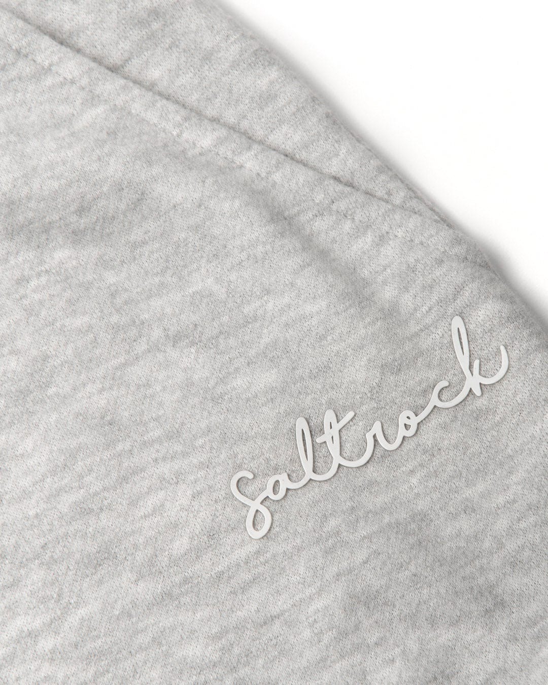 A close up of a Velator - Womens Sweat Shorts - Light Grey with the word Saltrock embroidered on it.