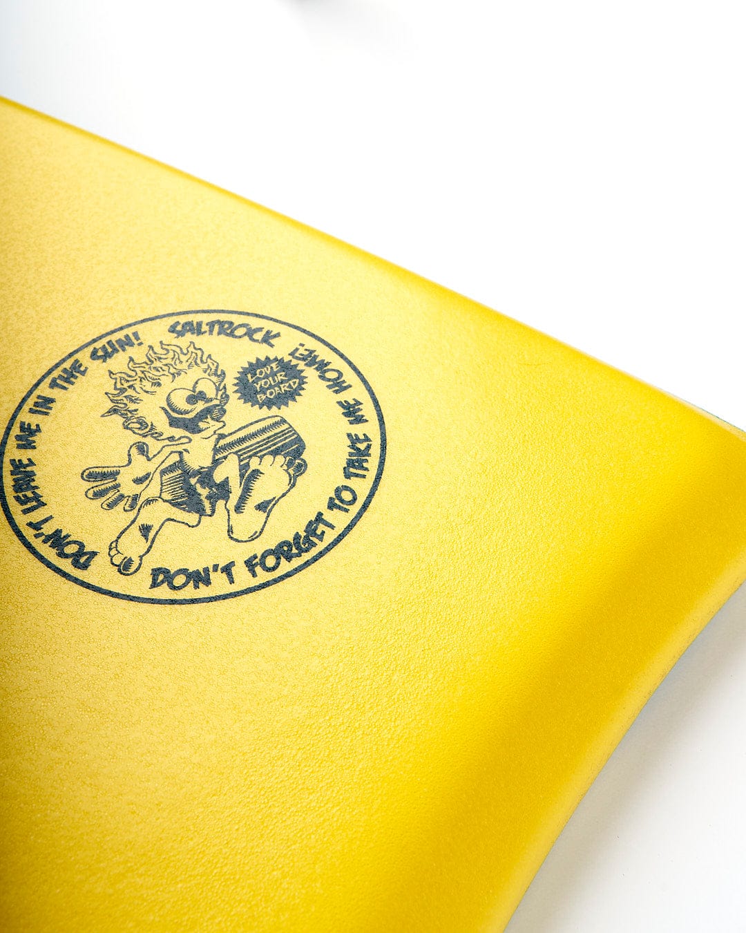 A yellow Saltrock notebook with a Warp 37" Bodyboard - Blue logo on it.