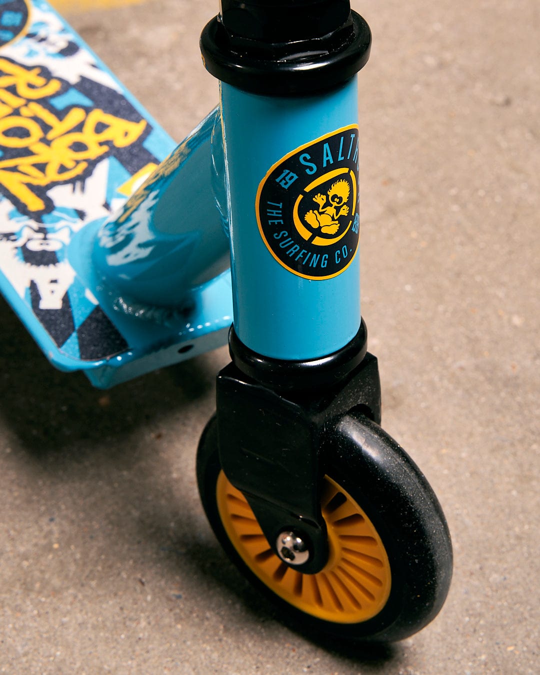 A Saltrock blue Warped - Stunt Scooter with a yellow wheel.