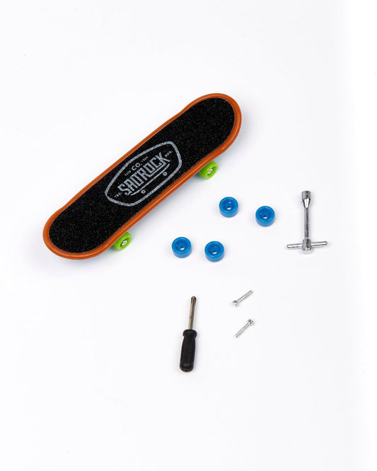 A Warp Icon - Digit Decks - Blue finger skateboard with a screwdriver and a set of mini screws by Saltrock.