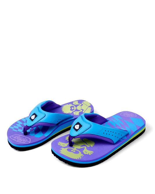 A pair of Warp Icon - Kids Flip Flops - Blue and purple flip-flops with a floral pattern on the purple sole, displayed against a white background by Saltrock.