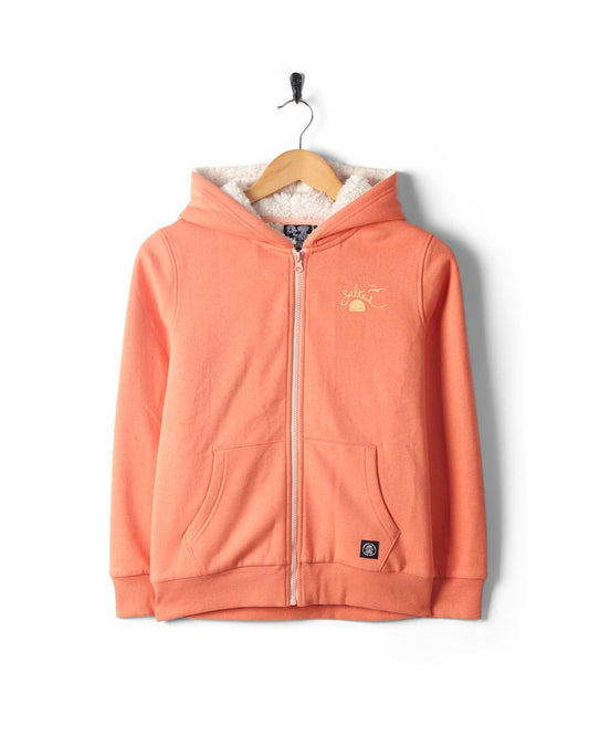 An orange Waveline - Kids Borg Lined Zip Hoodie in Coral, displayed on a hanger against a white background, featuring embroidered details on the chest by Saltrock.