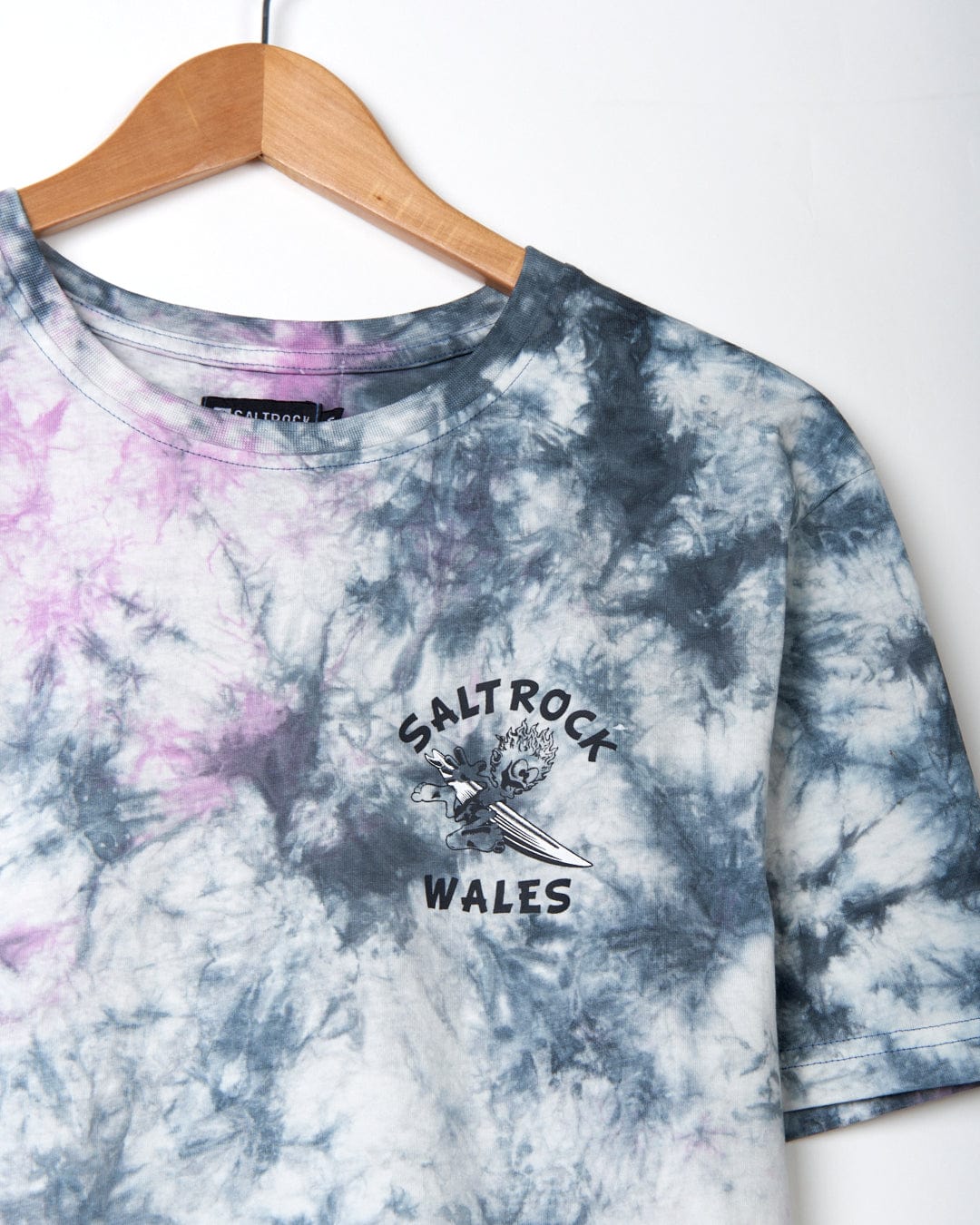 Wave Rider Wales - Mens Short Sleeve T-Shirt - Pink Tie Dye with "Saltrock" logo hanging on a wooden hanger against a white background, made from 100% Cotton.