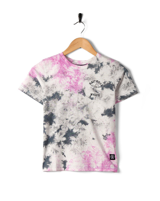 Wave Rider Wales - Kids Tie Dye Short Sleeve T-Shirt in Pink and black patterns on a hanger against a white background, featuring Saltrock branding.
