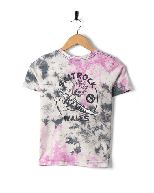 Wave Rider Wales - Kids Tie Dye Short Sleeve T-Shirt - Pink with Saltrock branding hanging on a wall-mounted hanger.