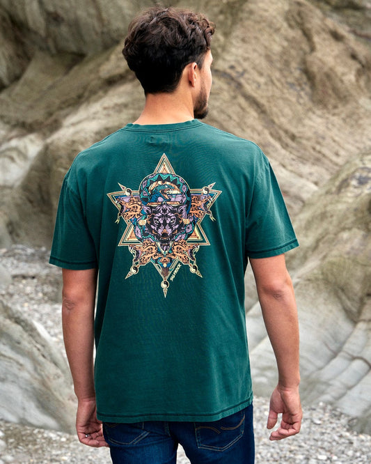 The back of a man wearing a Saltrock Wolfscale - Mens Short Sleeve T-Shirt - Dark Green with a snake graphic.