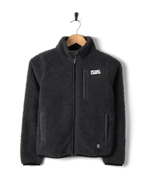 Wyer - Kids Fleece - Zip - Dark Grey Sherpa fleece jacket by Saltrock on a hanger against a white background.