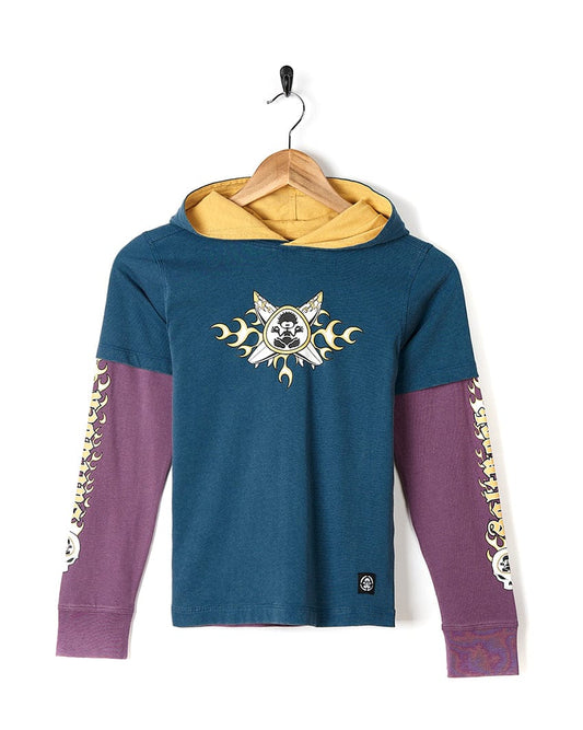 A Saltrock X Boards - Kids Hooded Tee - Blue/Purple with a skull and crossbones on it.