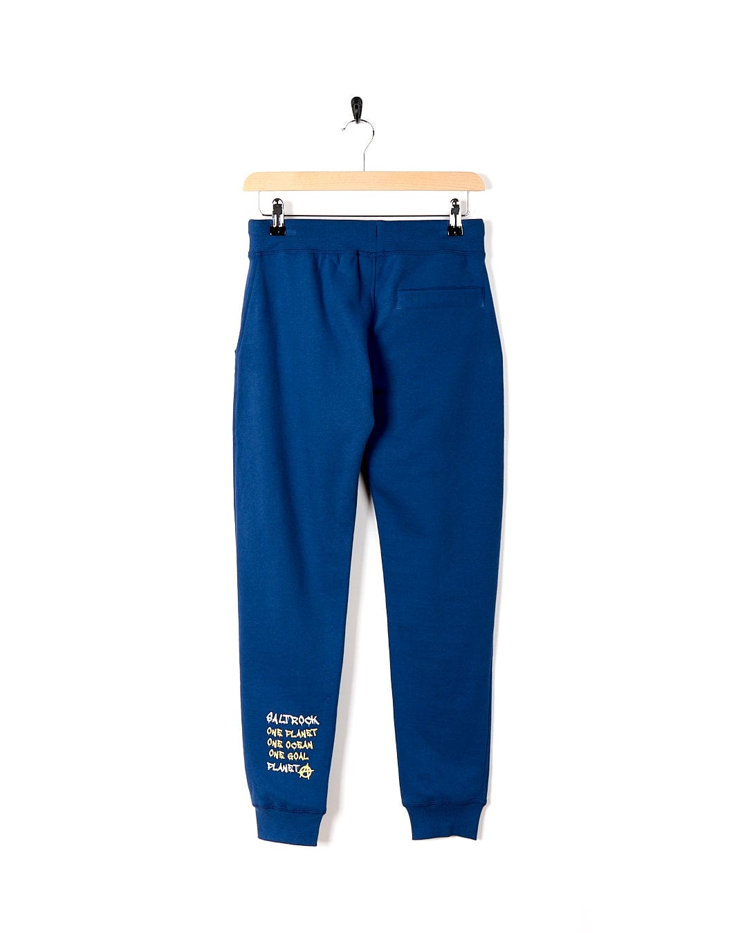 An Activist A - Kids Jogger - Dark Blue jogging pant with yellow writing on it by Saltrock.