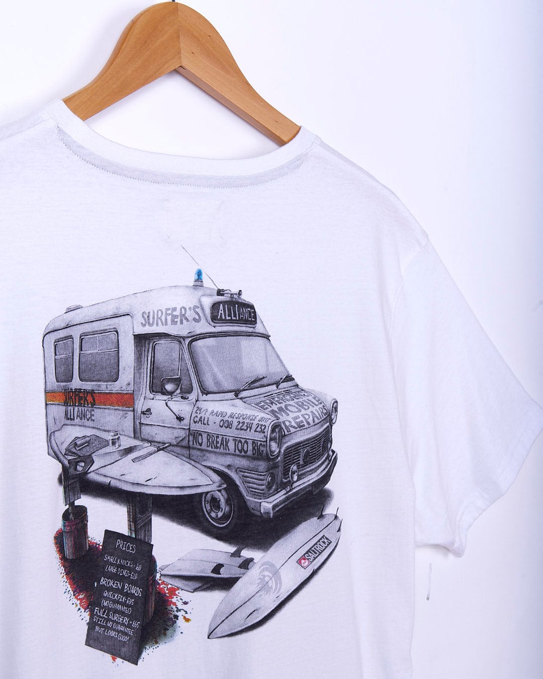 A Saltrock white t-shirt with a drawing of an Ambulance and surfboards.