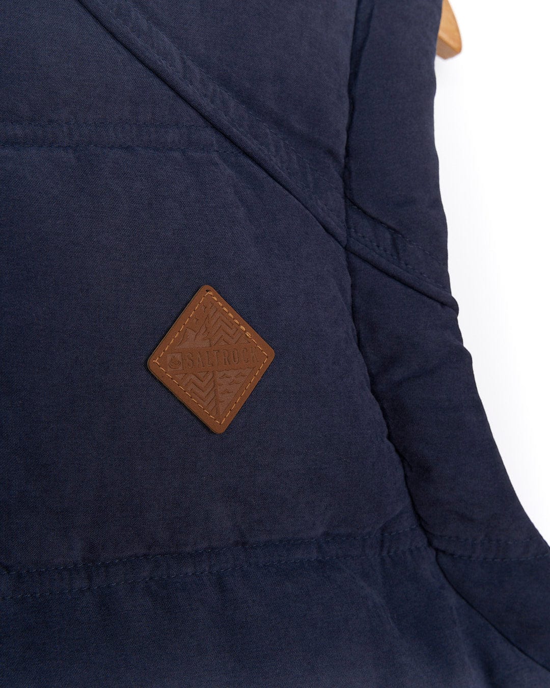 A Bardsey - Mens Gilet - Blue with a leather patch on it. Brand: Saltrock