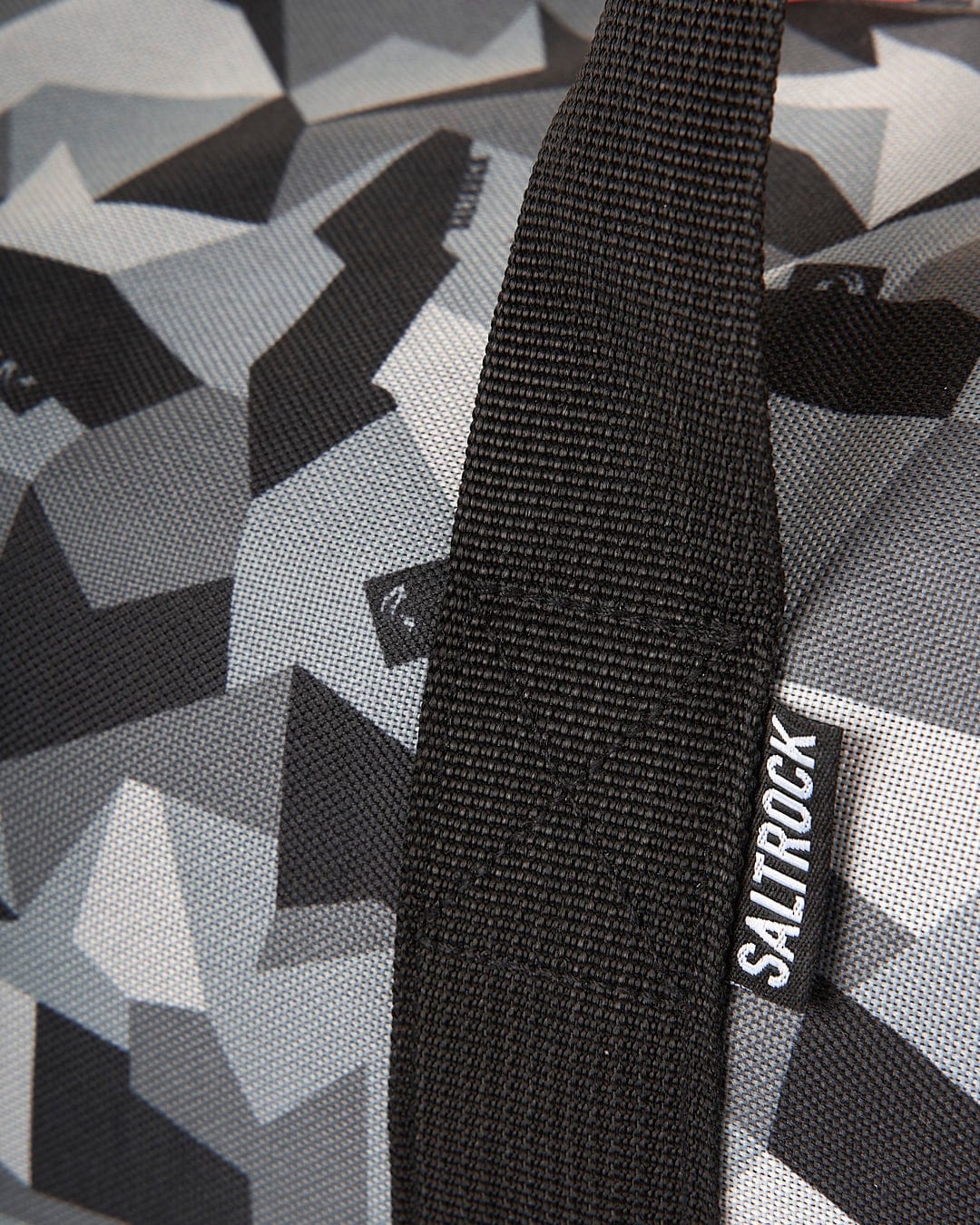 A Saltrock Camo Balboa - Hold-All Bag - Dark Grey with a grey and black camouflage pattern.