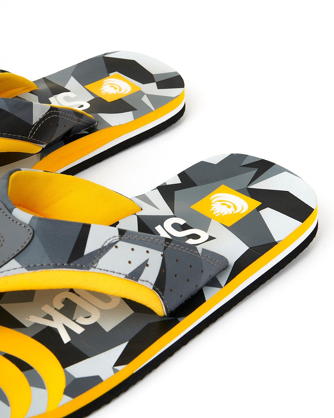 A pair of Saltrock Camo Corp Flip Flops with yellow and grey designs featuring Dark Grey accents.