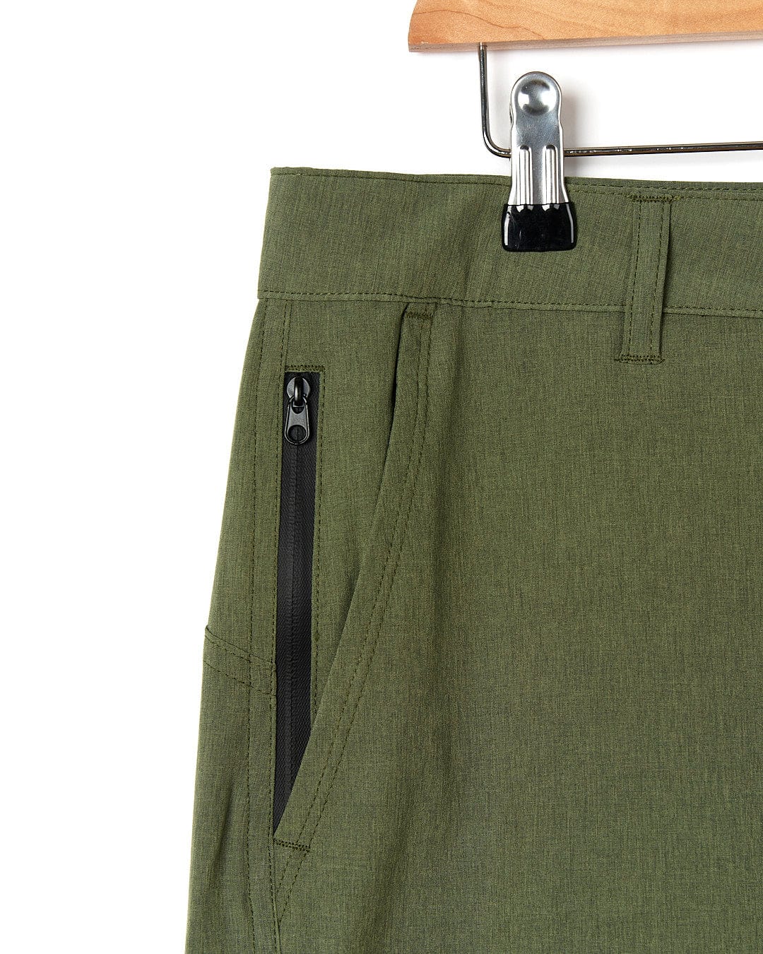 Essential men's shorts, the Cargo Amphibian II - Mens Boardshort - Dark Green from Saltrock, are neatly displayed on a hanger.