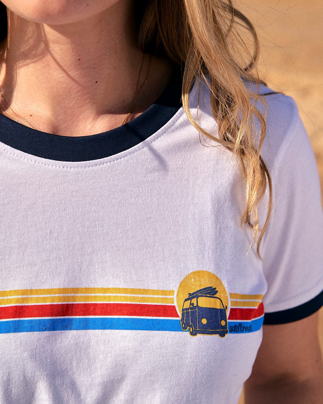 A woman wearing a Saltrock Celeste Stripe - Womens Ringer Tee - White.