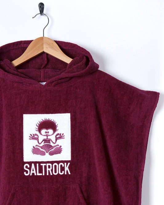 A maroon hoodie with the word Saltrock Classic Kids Changing Towel - Pink on it.