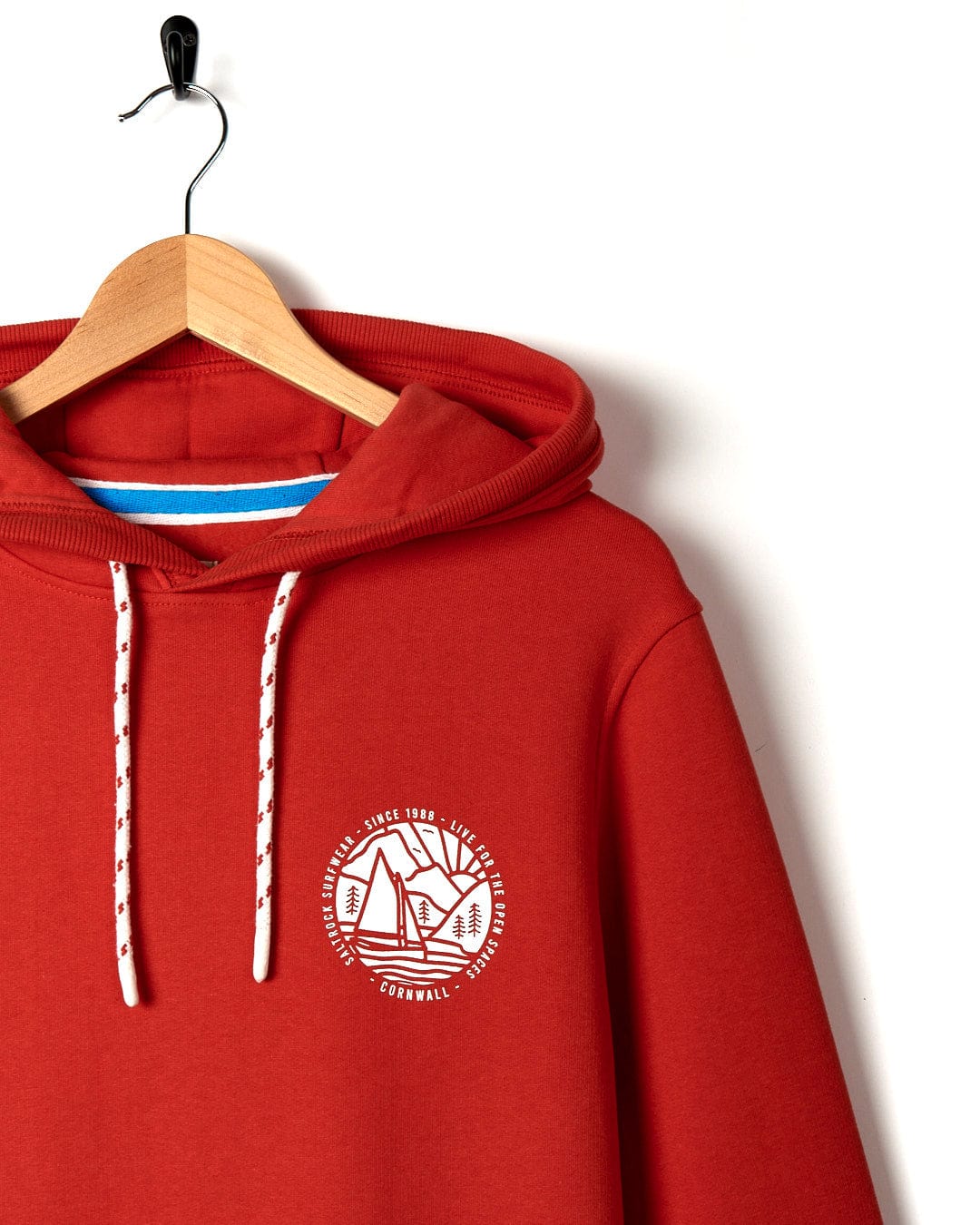 A Cornwall Sailaway - Mens Pop Hoodie - Red with a white Saltrock logo on it.