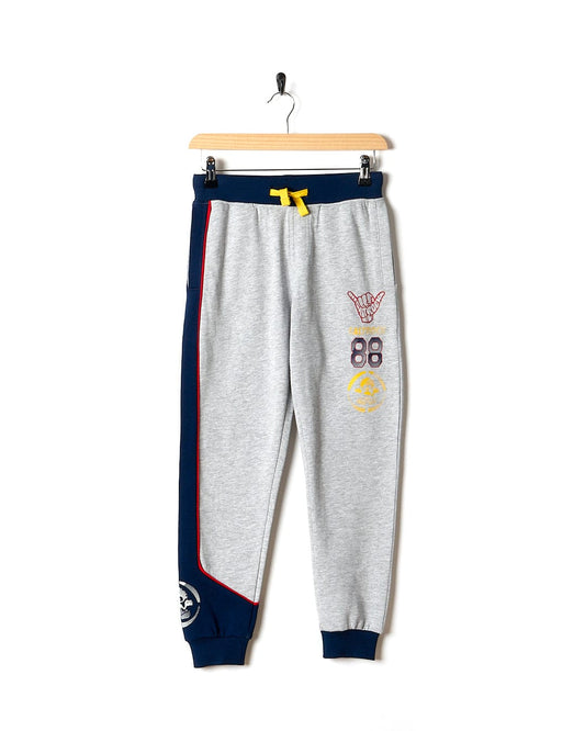 A Curby - Kids Jogger - Grey pant with blue and grey stripes by Saltrock.