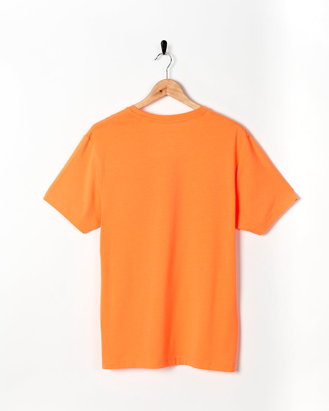 An Saltrock Flame Tri - Mens Recycled Short Sleeve T-Shirt - Light Orange hanging on a white wall.