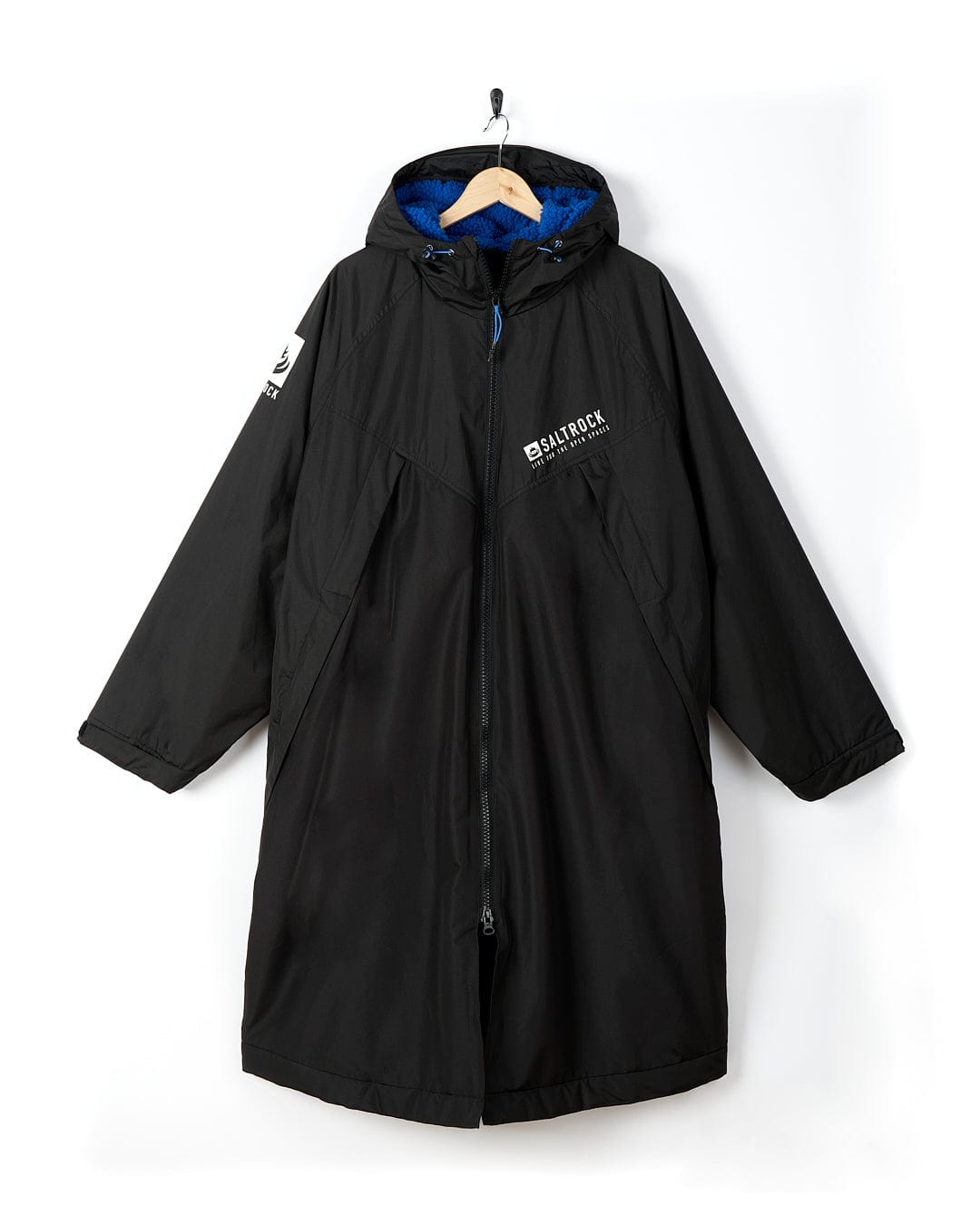 A Saltrock Four Seasons - Waterproof Changing Robe - Black/Blue hooded coat hanging on a hanger.