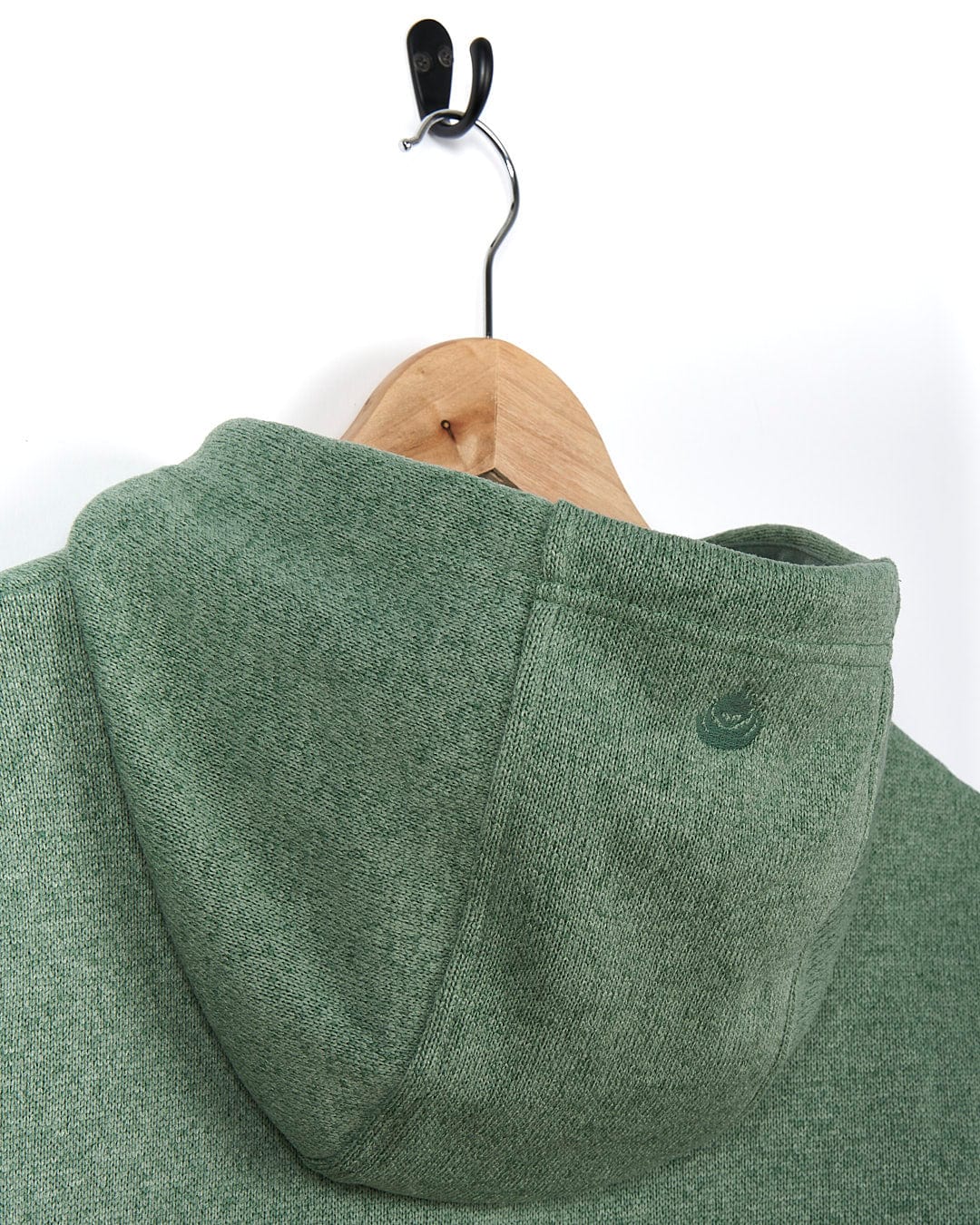 A Saltrock Galaksea - Womens 1/4 Zip Fleece - Light Green hoodie hanging on a hanger.