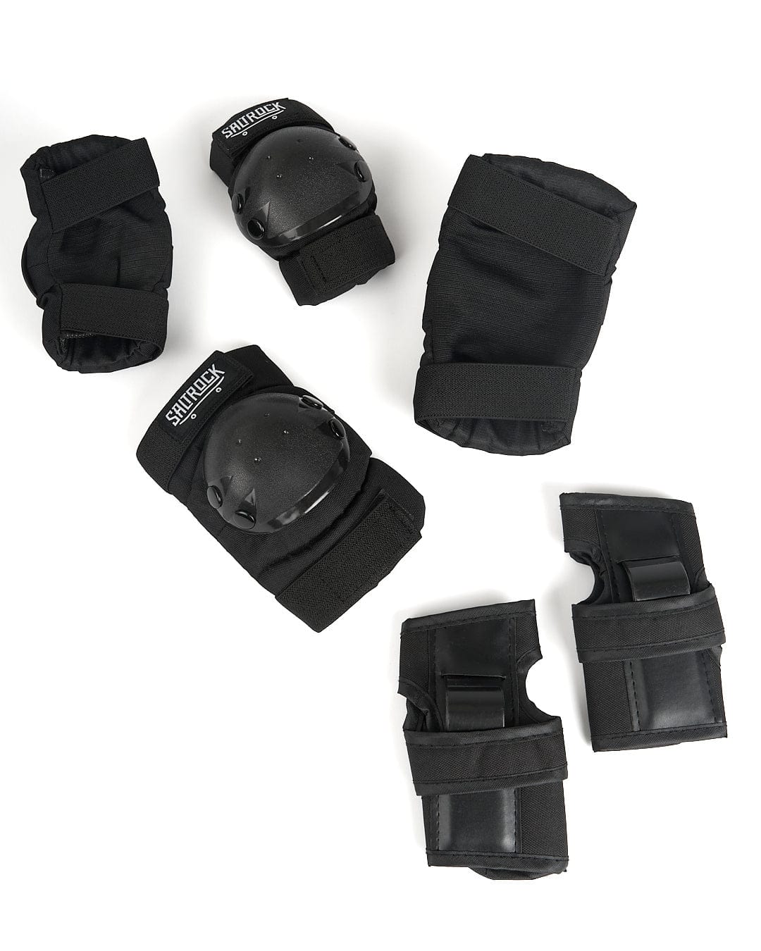 A set of Hardskate - Skate Pads - Black knee pads, elbow pads and knee pads by Saltrock.